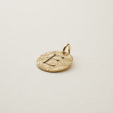 Tropic Initial Charm